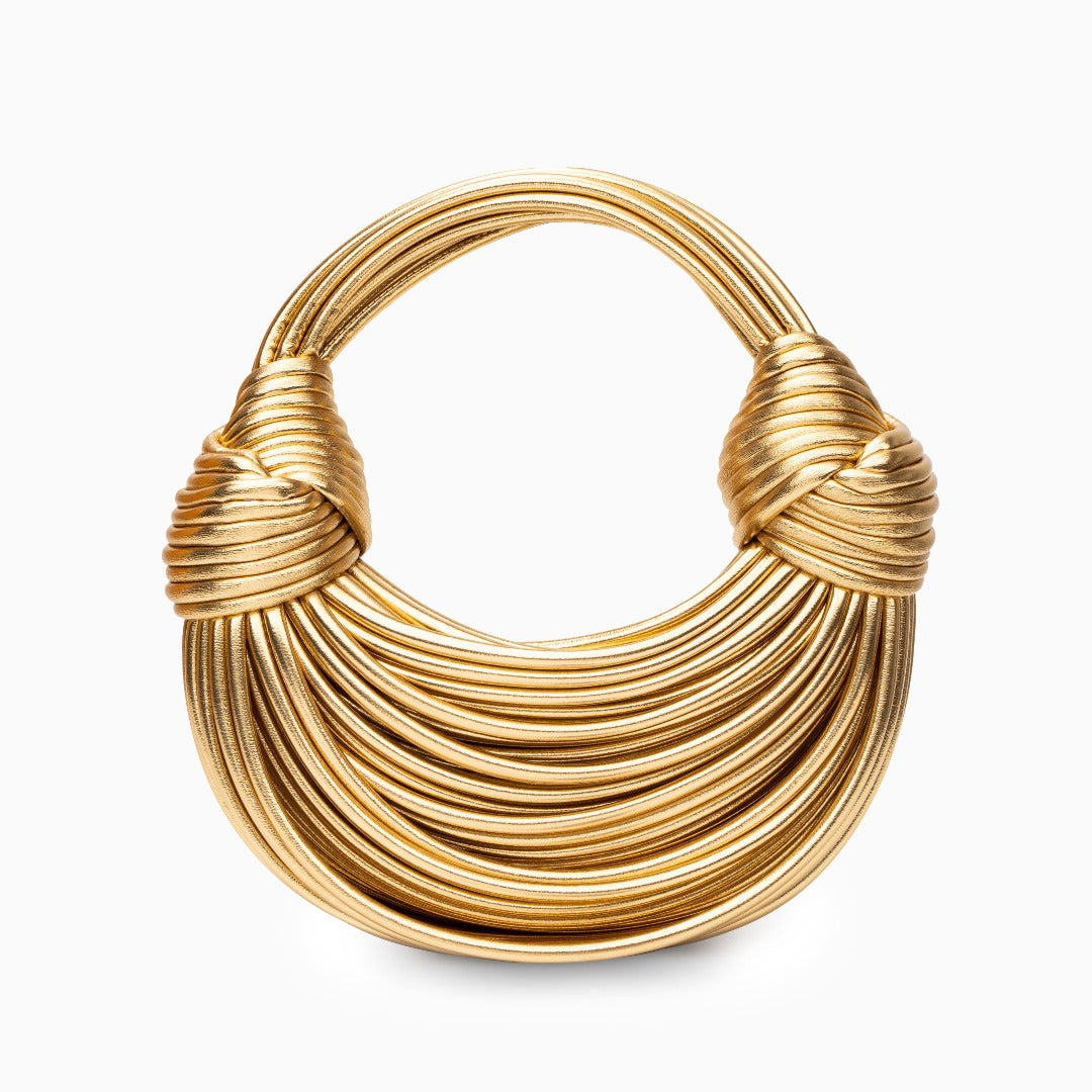 Skulptural Handväska i Guldigt Veganskt Läder – Modern Design med Knutdetaljer, 26x9x15 cm Handväskor Velinoro Guld